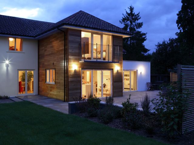 Large house illuminated in the evening